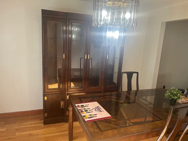 a view of a room with mirror and door
