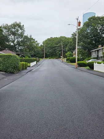 a view of a road with a building in the background