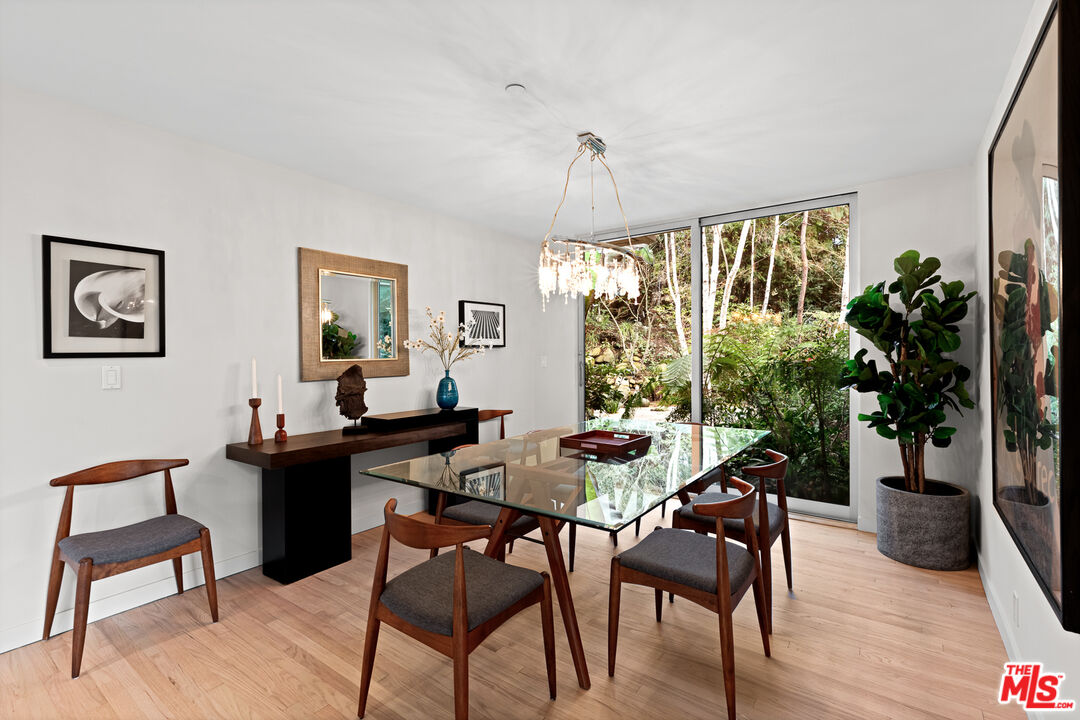 3114 Streamview Lane Studio City, CA 91604 - Photo 13 of 75 a view of a livingroom and dining room with furniture window and wooden floor
