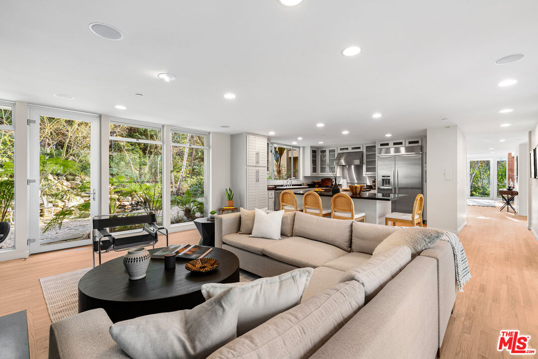 3114 Streamview Lane Studio City, CA 91604 - Photo 14 of 75 a living room with furniture and floor to ceiling windows