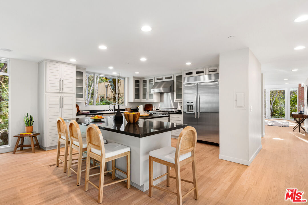 3114 Streamview Lane Studio City, CA 91604 - Photo 16 of 75 a view of a dining room with furniture window and wooden floor