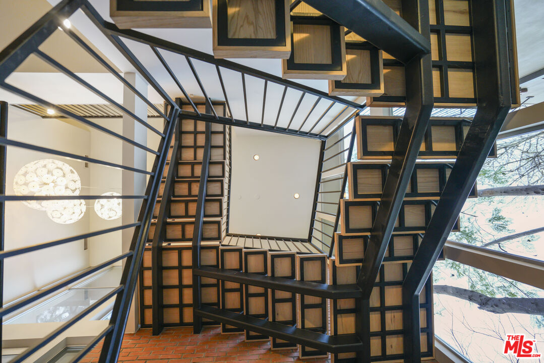 3114 Streamview Lane Studio City, CA 91604 - Photo 21 of 75 a view of staircase with large window and wooden floor