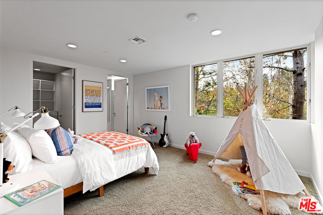 3114 Streamview Lane Studio City, CA 91604 - Photo 25 of 75 a bedroom with a bed and wooden floor