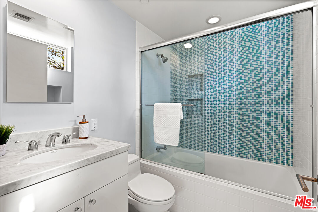 3114 Streamview Lane Studio City, CA 91604 - Photo 26 of 75 a bathroom with a granite countertop bathtub shower sink vanity mirror and toilet