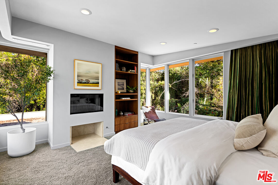 3114 Streamview Lane Studio City, CA 91604 - Photo 29 of 75 a bedroom with a bed and a large window