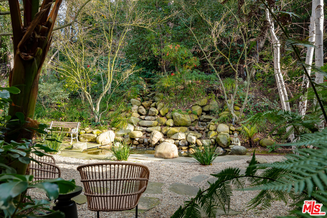 3114 Streamview Lane Studio City, CA 91604 - Photo 35 of 75 a view of a chair and table in the backyard