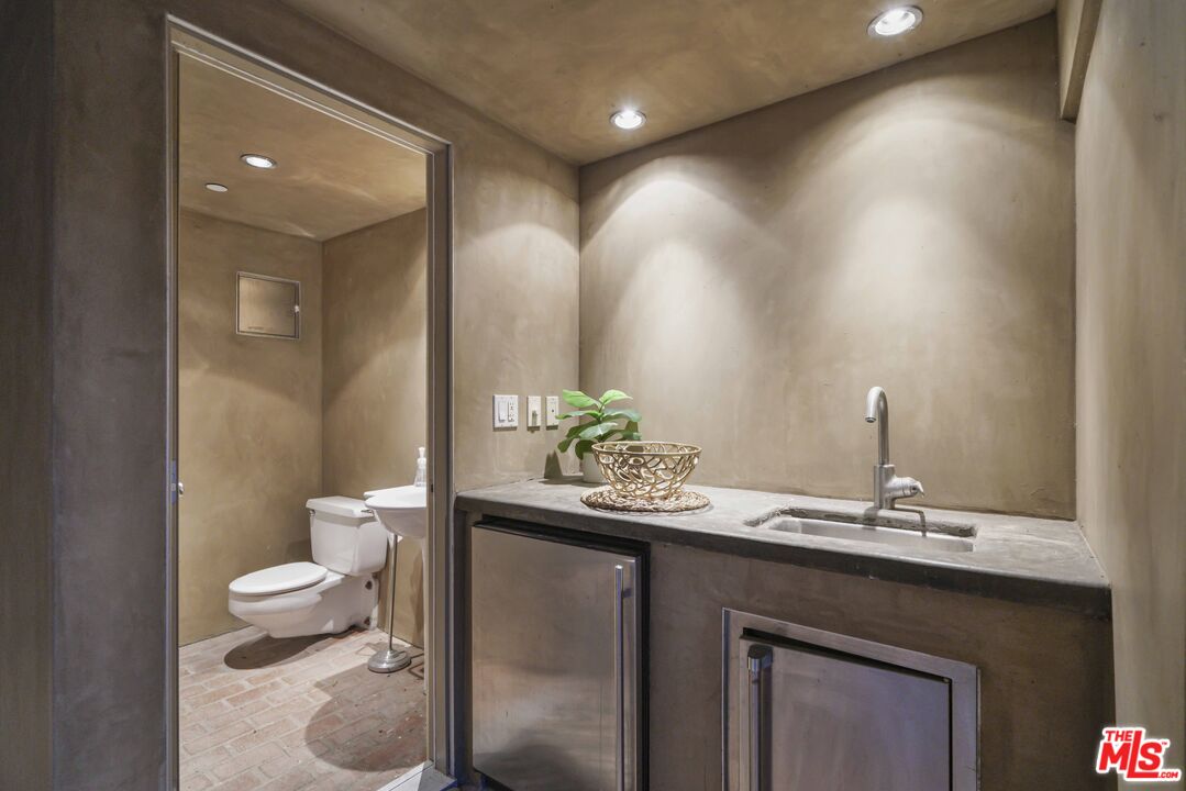 3114 Streamview Lane Studio City, CA 91604 - Photo 49 of 75 a bathroom with a sink and a toilet