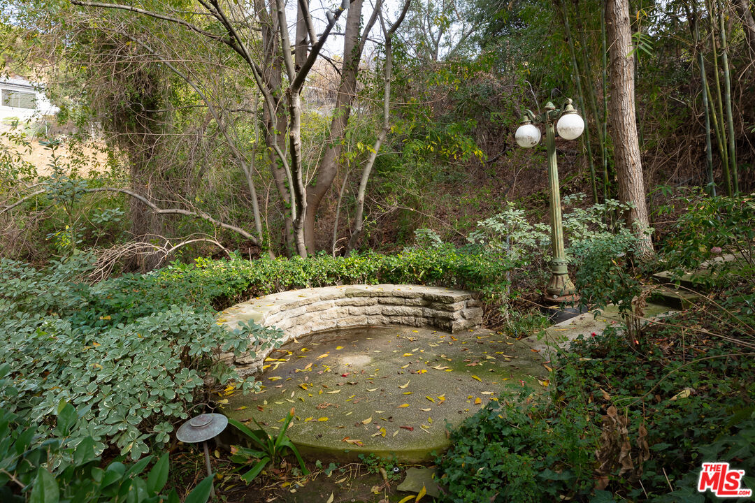 3114 Streamview Lane Studio City, CA 91604 - Photo 58 of 75 a view of a backyard of a house with lots of green space
