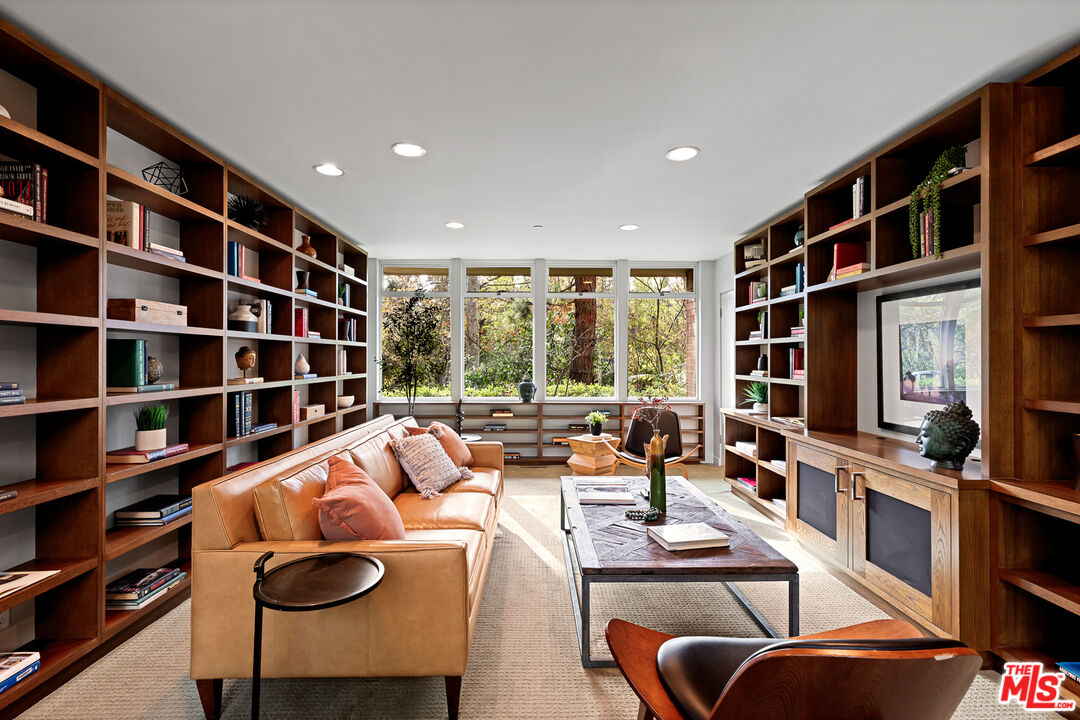 3114 Streamview Lane Studio City, CA 91604 - Photo 9 of 75 a living room with furniture and a bookshelf