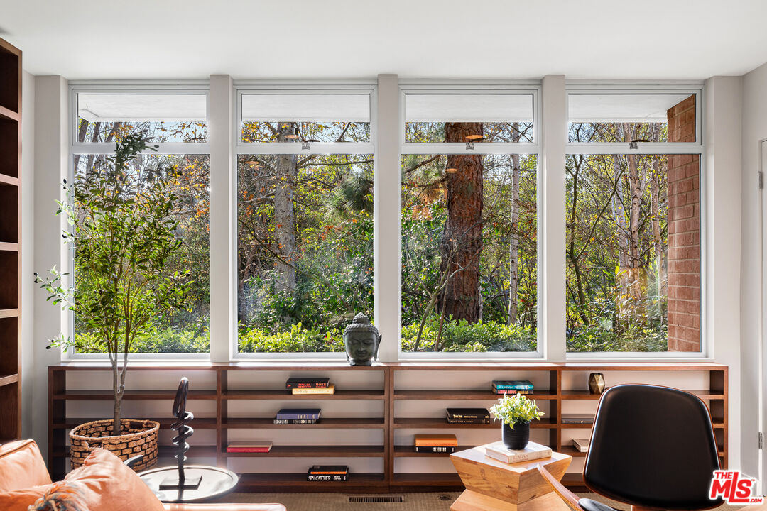 3114 Streamview Lane Studio City, CA 91604 - Photo 10 of 75 a living room filled with furniture and a large window