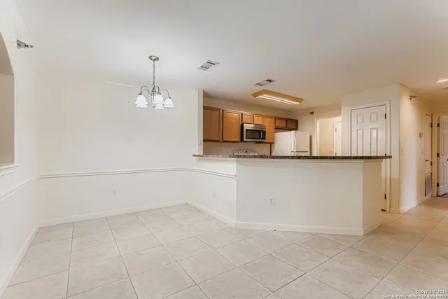 a view of a kitchen with a sink