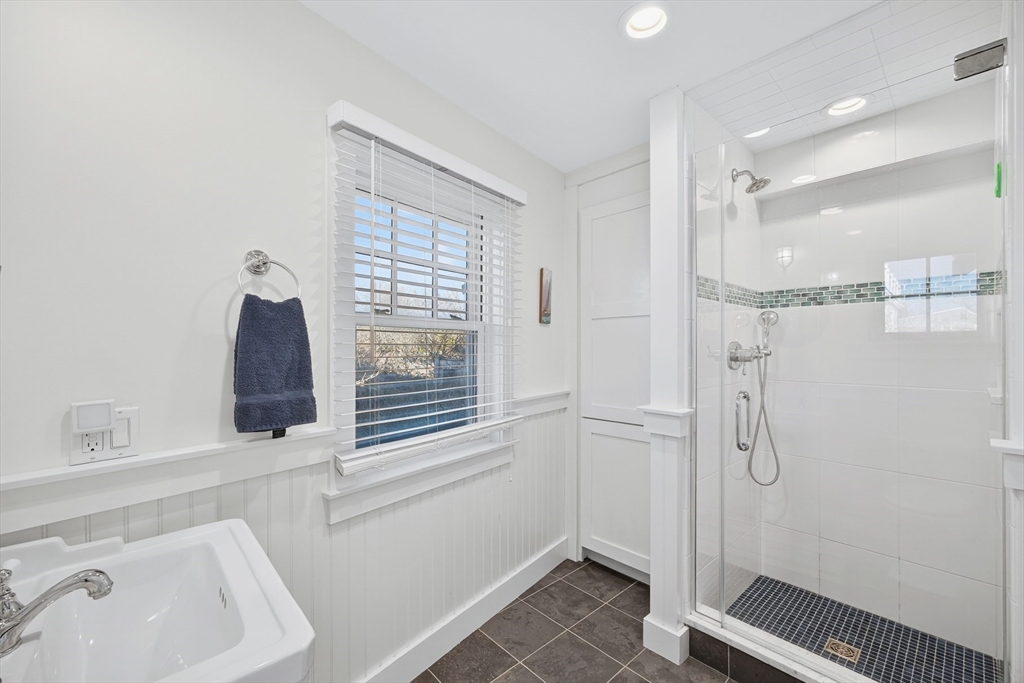 1145 Kingsbury Beach Road Eastham, MA 02642 - Photo 28 of 42 a bathroom with a sink and a shower