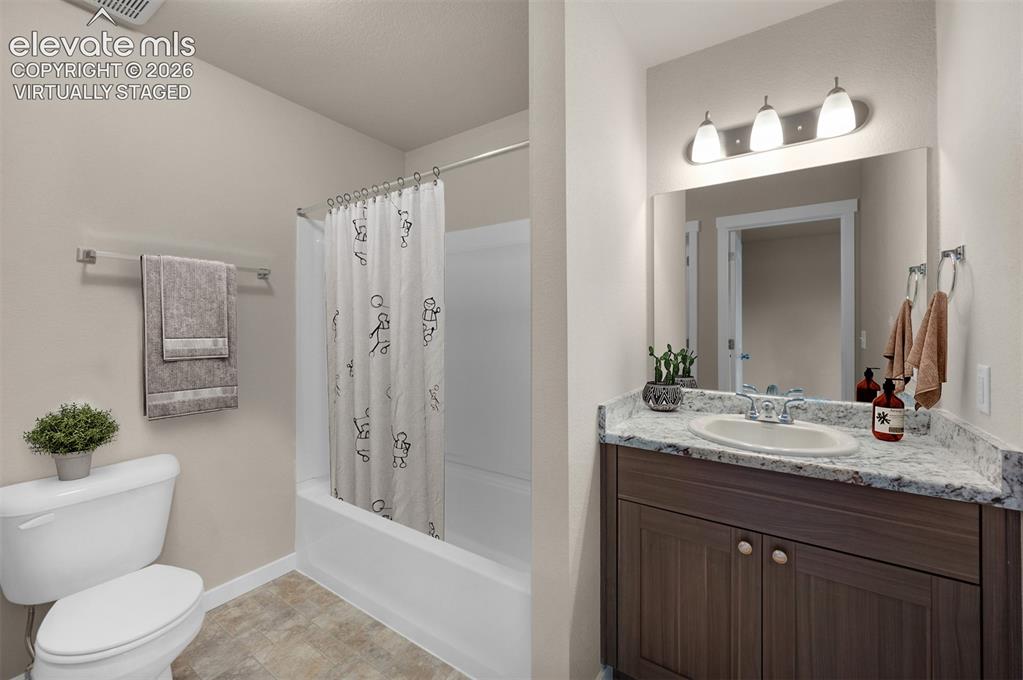 6644 Rawhide Rdg View Colorado Springs, CO 80915 - Photo 16 of 26 a bathroom with a sink a toilet and shower