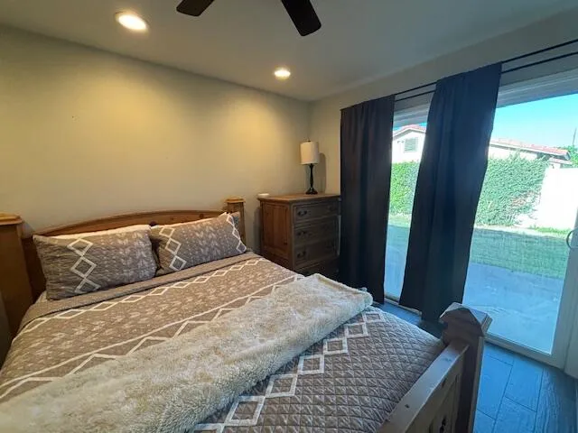 a bedroom with a bed and a dresser