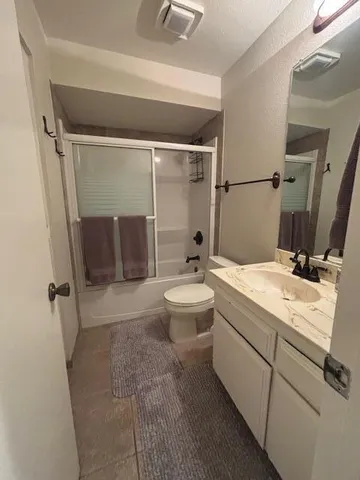 a bedroom with a bed and a mirror