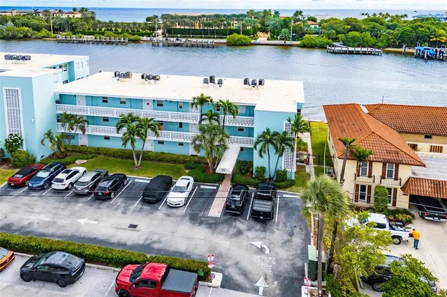 an aerial view of a house with a lake view