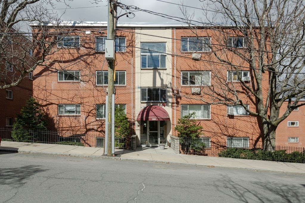 280 Corey Road, Unit 23 Boston, MA 02135 - Photo 16 of 19 front view of a building with a street
