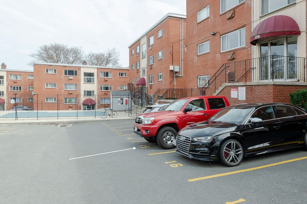 280 Corey Road, Unit 23 Boston, MA 02135 - Photo 19 of 19 a car parked in front of a building
