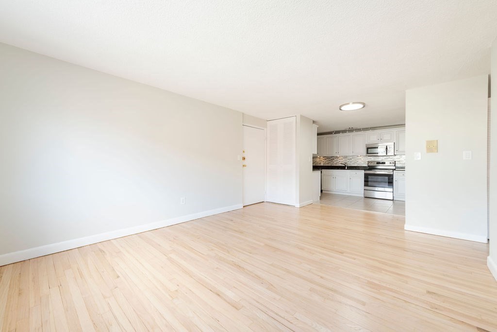 280 Corey Road, Unit 23 Boston, MA 02135 - Photo 5 of 19 a view of kitchen with wooden floor