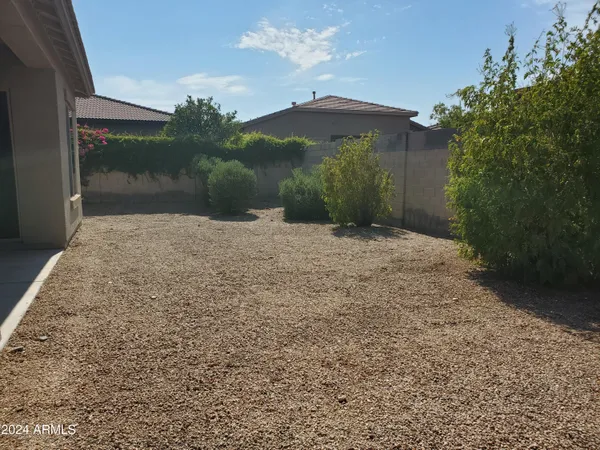 a view of a backyard of a house
