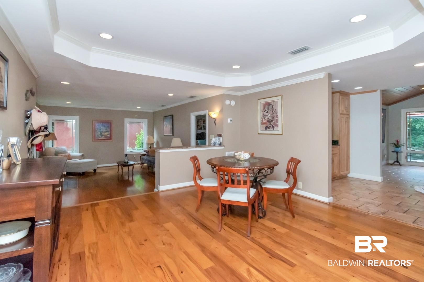 3212 Ward Road Mobile, AL 36605 - Photo 16 of 46 Dining area with a raised ceiling, crown molding, recessed lighting, and light wood finished floors