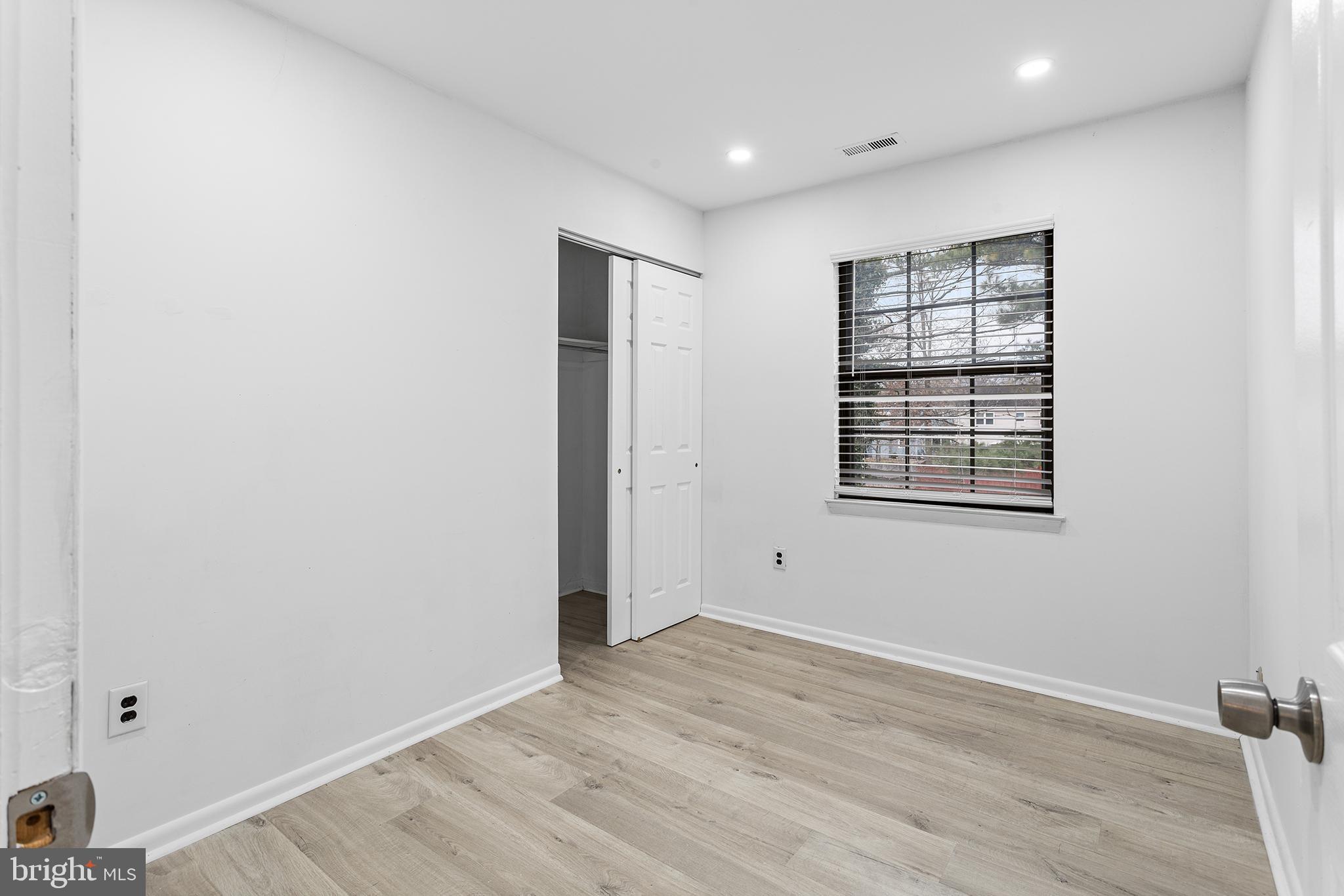 438 B Willow Turn Mount Laurel, NJ 08054 - Photo 17 of 27 an empty room with wooden floor and windows