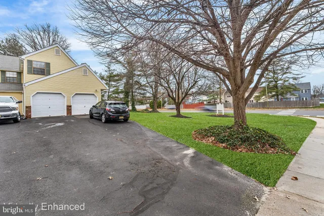 a car parked in front of white house