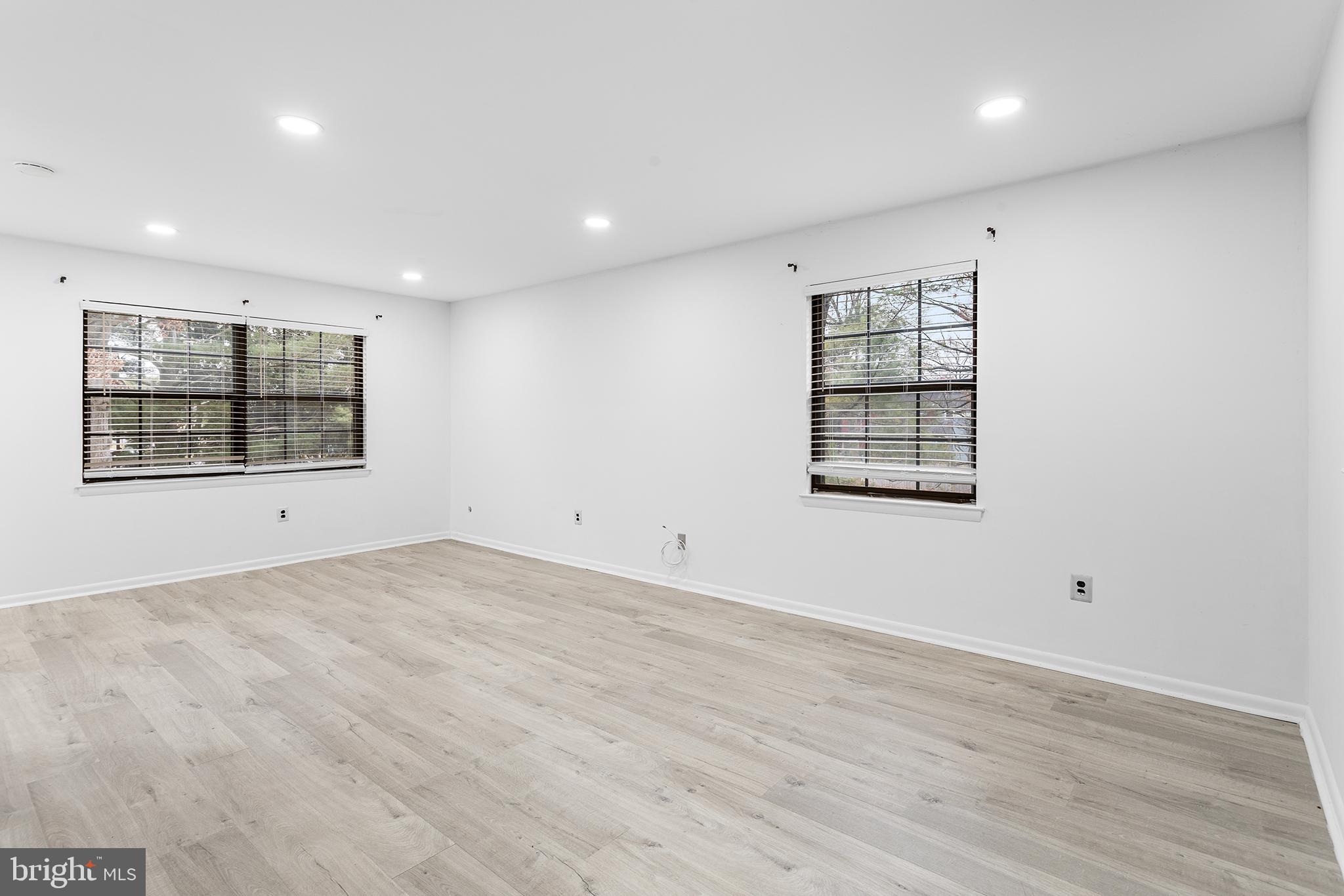 438 B Willow Turn Mount Laurel, NJ 08054 - Photo 7 of 27 an empty room with wooden floor and windows