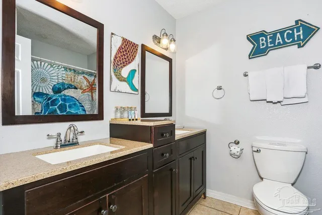 a living room with patio furniture and a floor to ceiling window