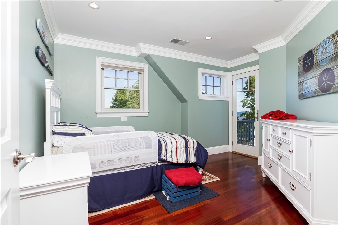 171 Eustis Avenue Newport, RI 02840 - Photo 35 of 39 Bedroom with balcony and water views