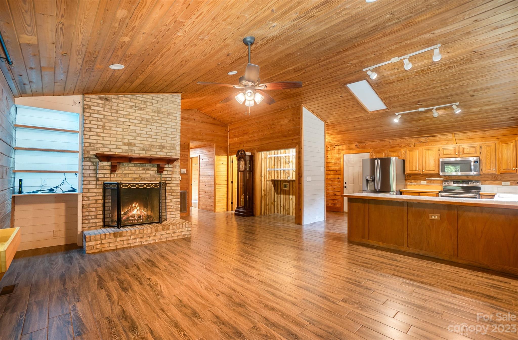 494 Graystone Road Rockwell, NC 28138 - Photo 13 of 36 a view of a kitchen with a sink and a fireplace
