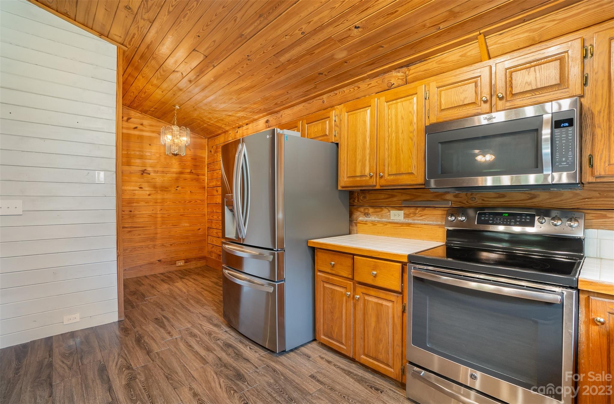 494 Graystone Road Rockwell, NC 28138 - Photo 19 of 36 a kitchen with appliances and wooden floor