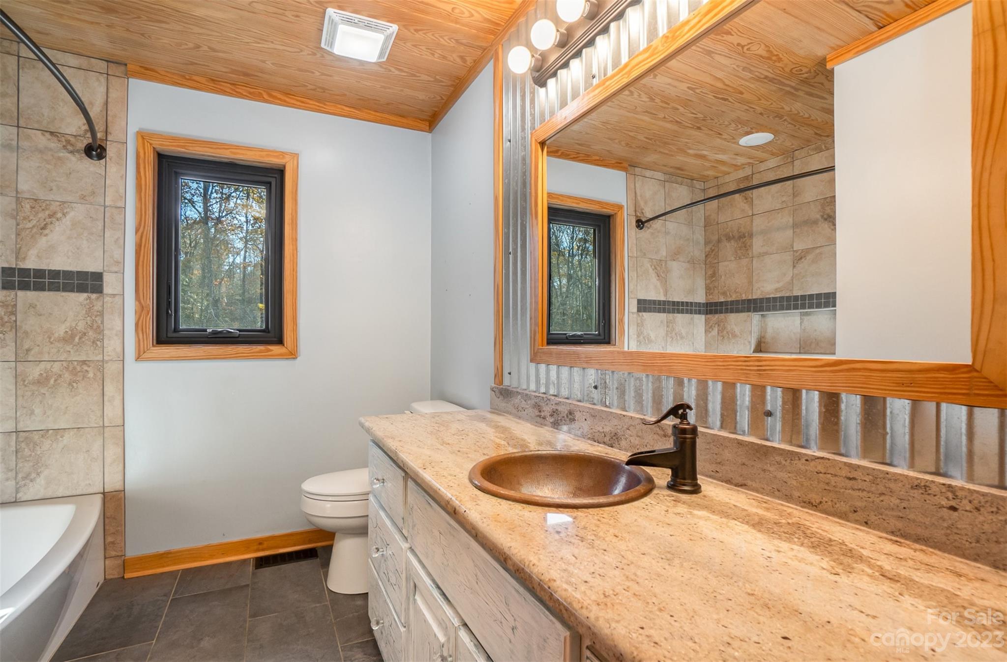 494 Graystone Road Rockwell, NC 28138 - Photo 20 of 36 a en suite bathroom with a granite countertop sink and a mirror