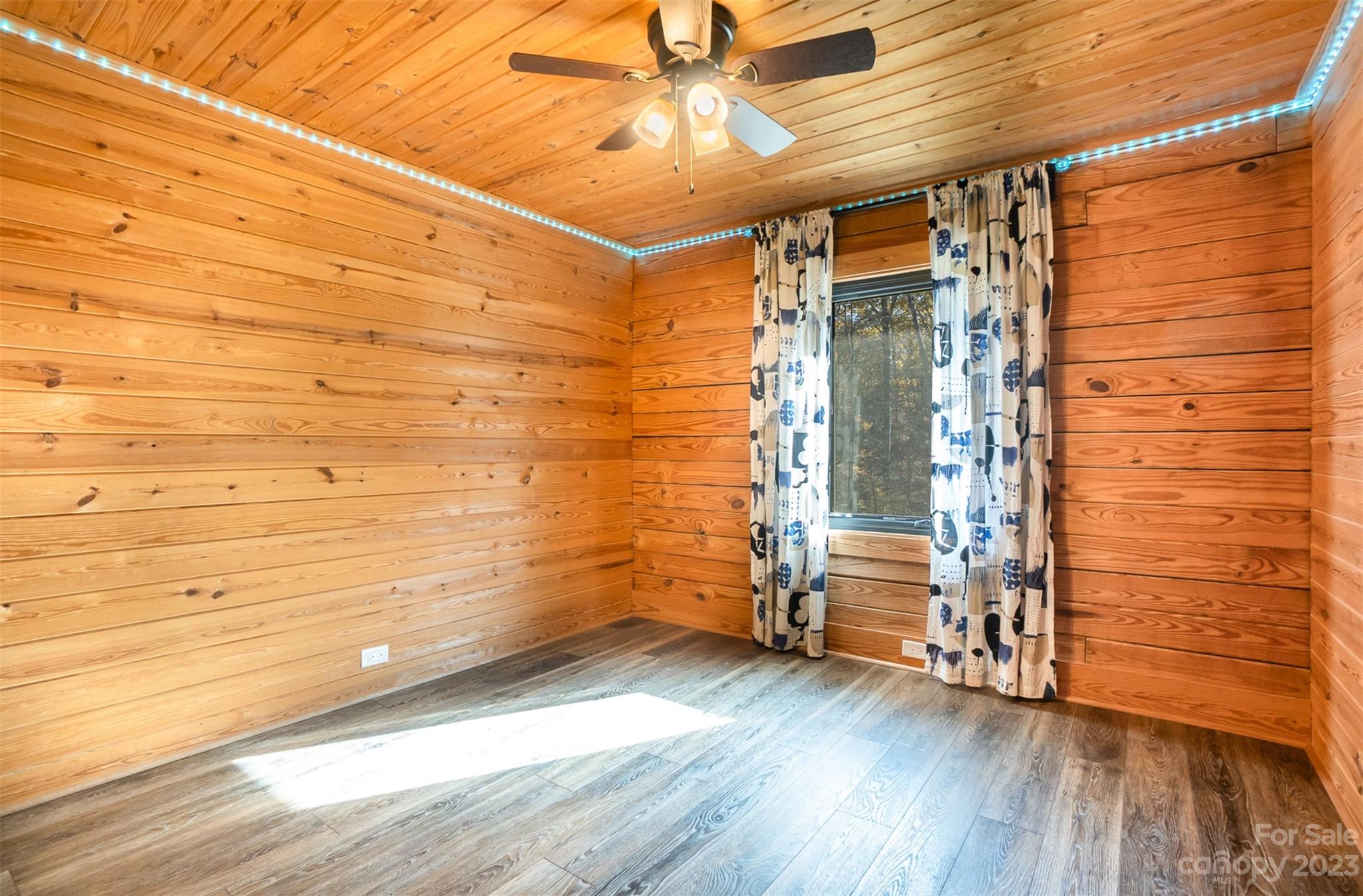 494 Graystone Road Rockwell, NC 28138 - Photo 21 of 36 a view of empty room with wooden floor