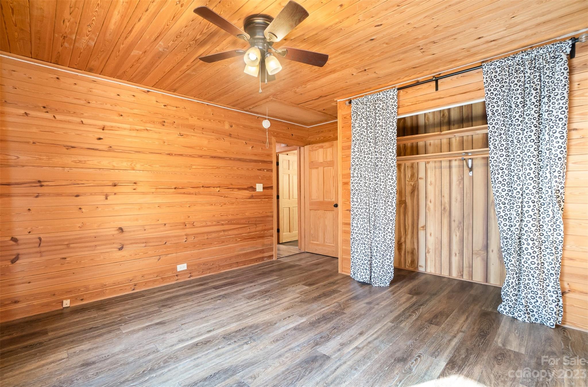 494 Graystone Road Rockwell, NC 28138 - Photo 24 of 36 a view of empty room with wooden floor and fan
