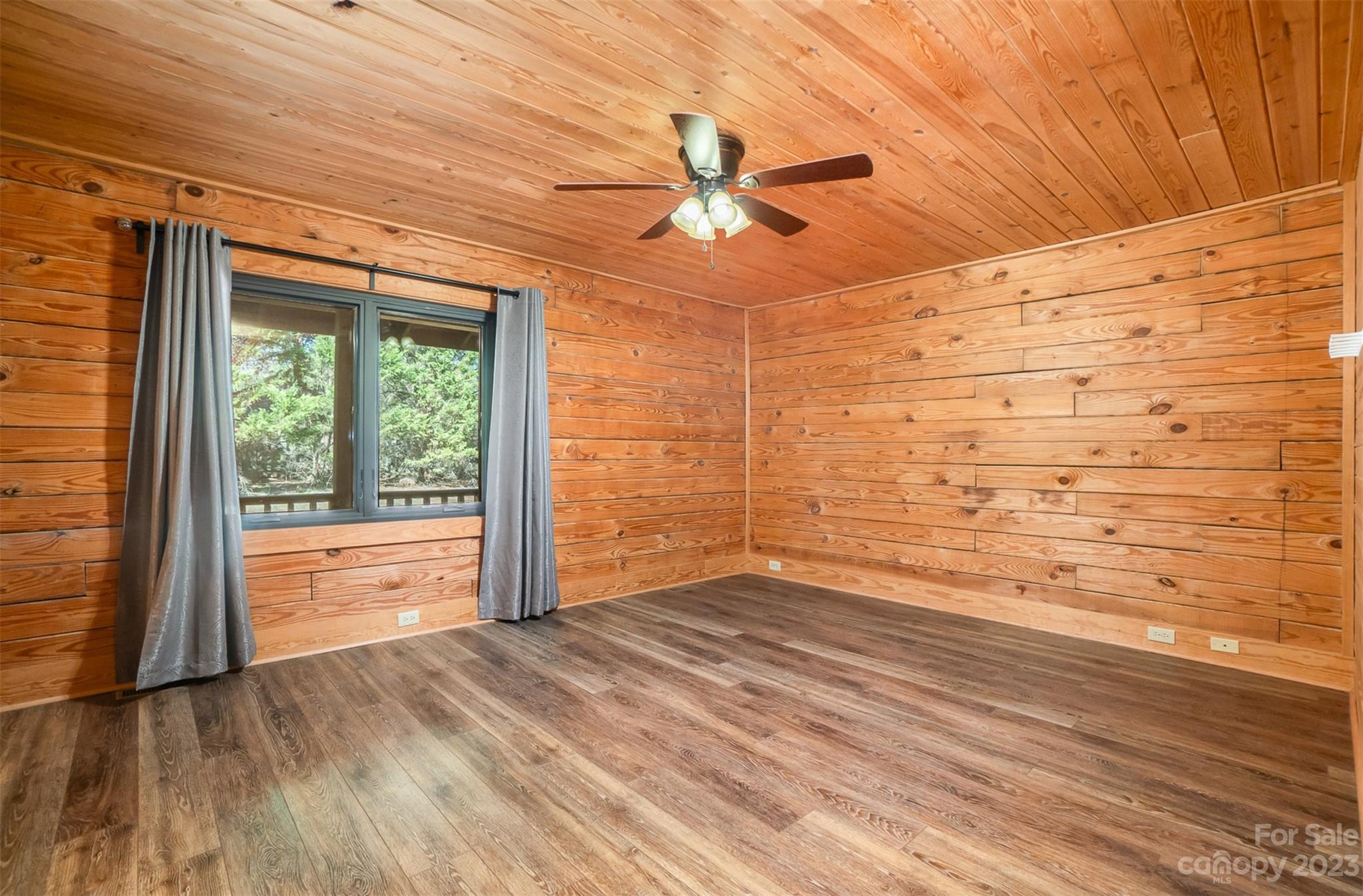 494 Graystone Road Rockwell, NC 28138 - Photo 25 of 36 a view of empty room with wooden floor and fan