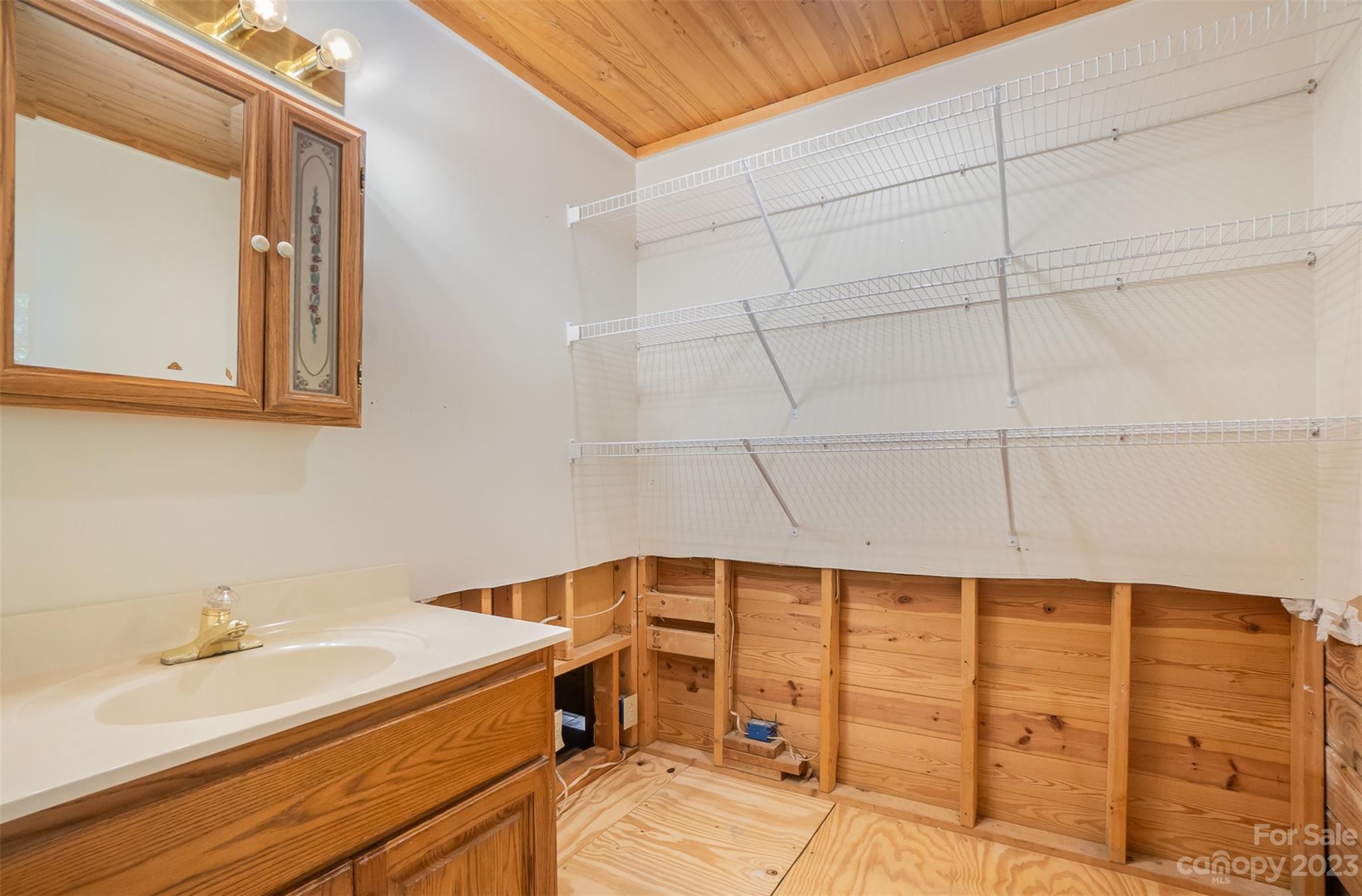 494 Graystone Road Rockwell, NC 28138 - Photo 27 of 36 a bathroom with a sink and a mirror