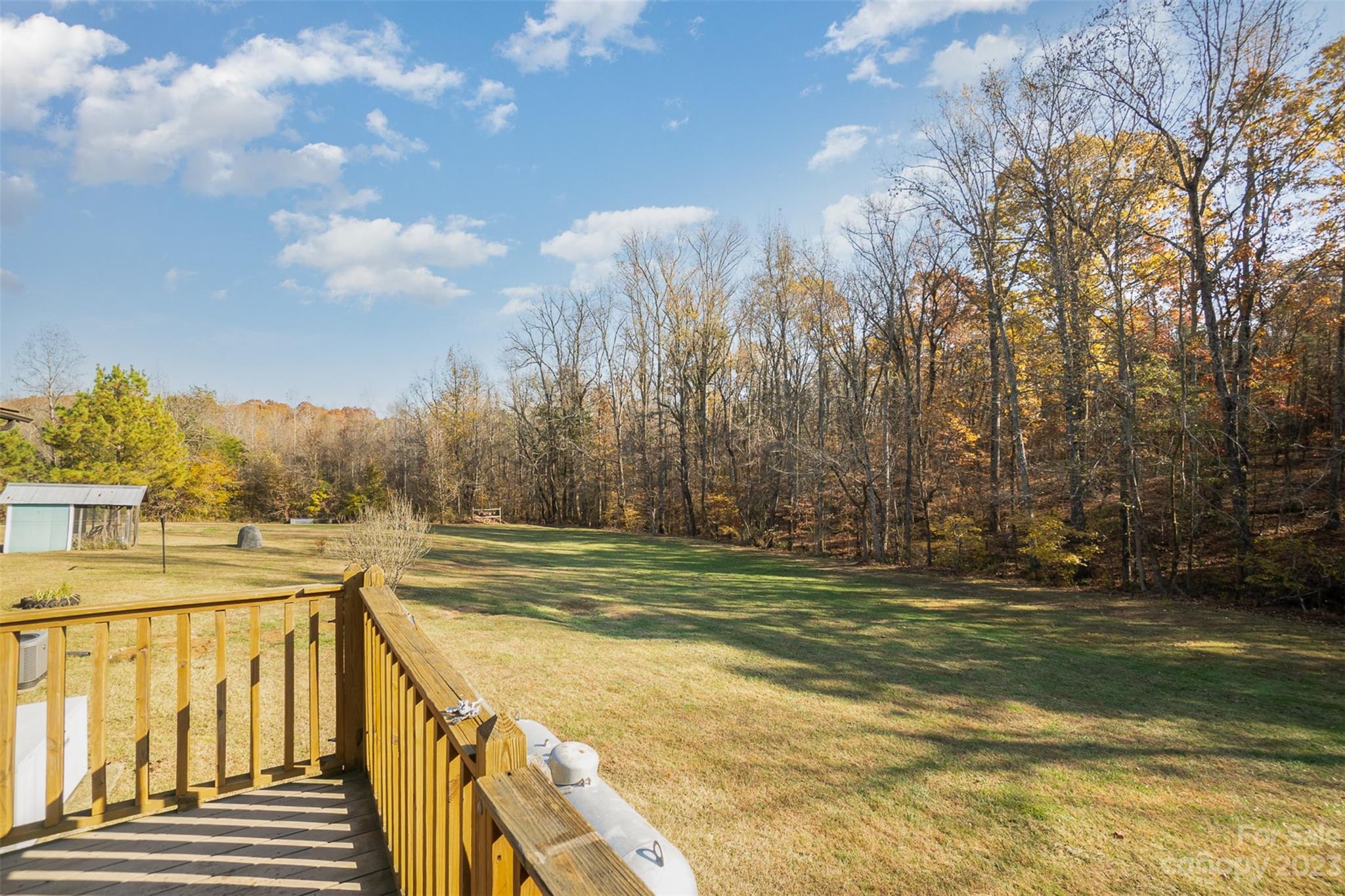 494 Graystone Road Rockwell, NC 28138 - Photo 5 of 36 a view of a yard with swimming pool and trees