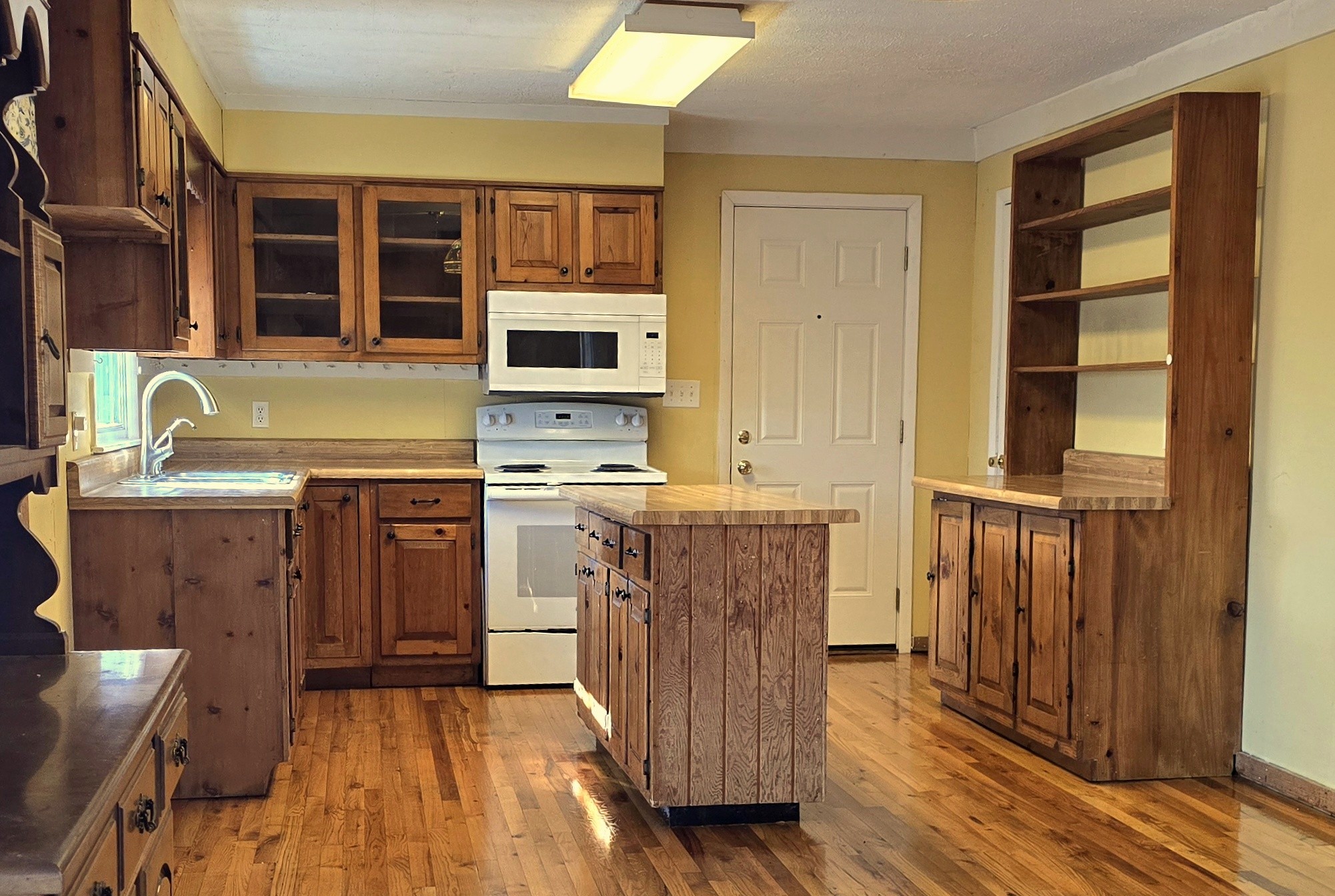 3467 Shouse Road Santa Fe, TN 38482 - Photo 19 of 55 a kitchen with stainless steel appliances granite countertop a stove a sink and a microwave