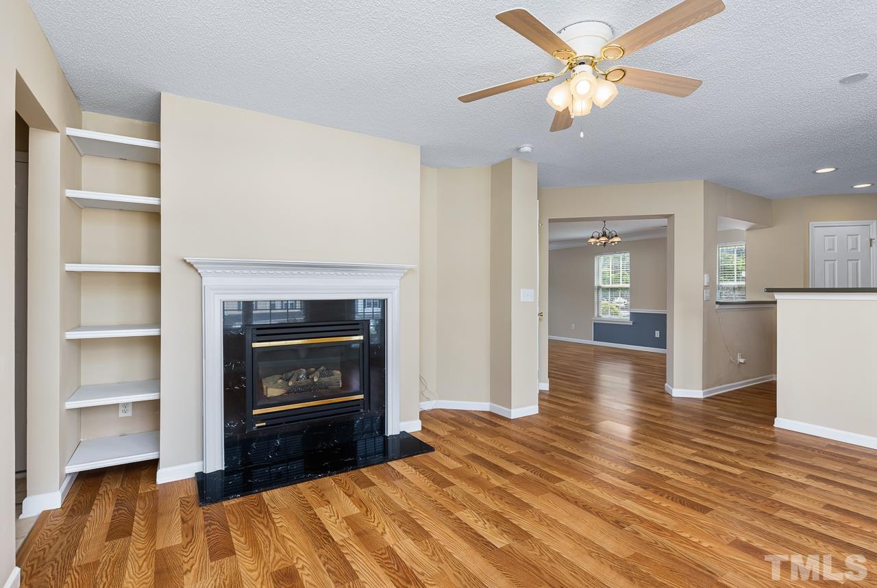 4808 Marathon Lane Raleigh, NC 27616 - Photo 14 of 31 a bedroom with a bed and a fireplace