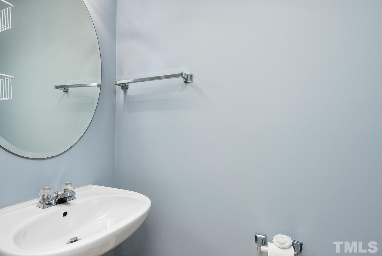 4808 Marathon Lane Raleigh, NC 27616 - Photo 16 of 31 a bathroom with a sink and mirror