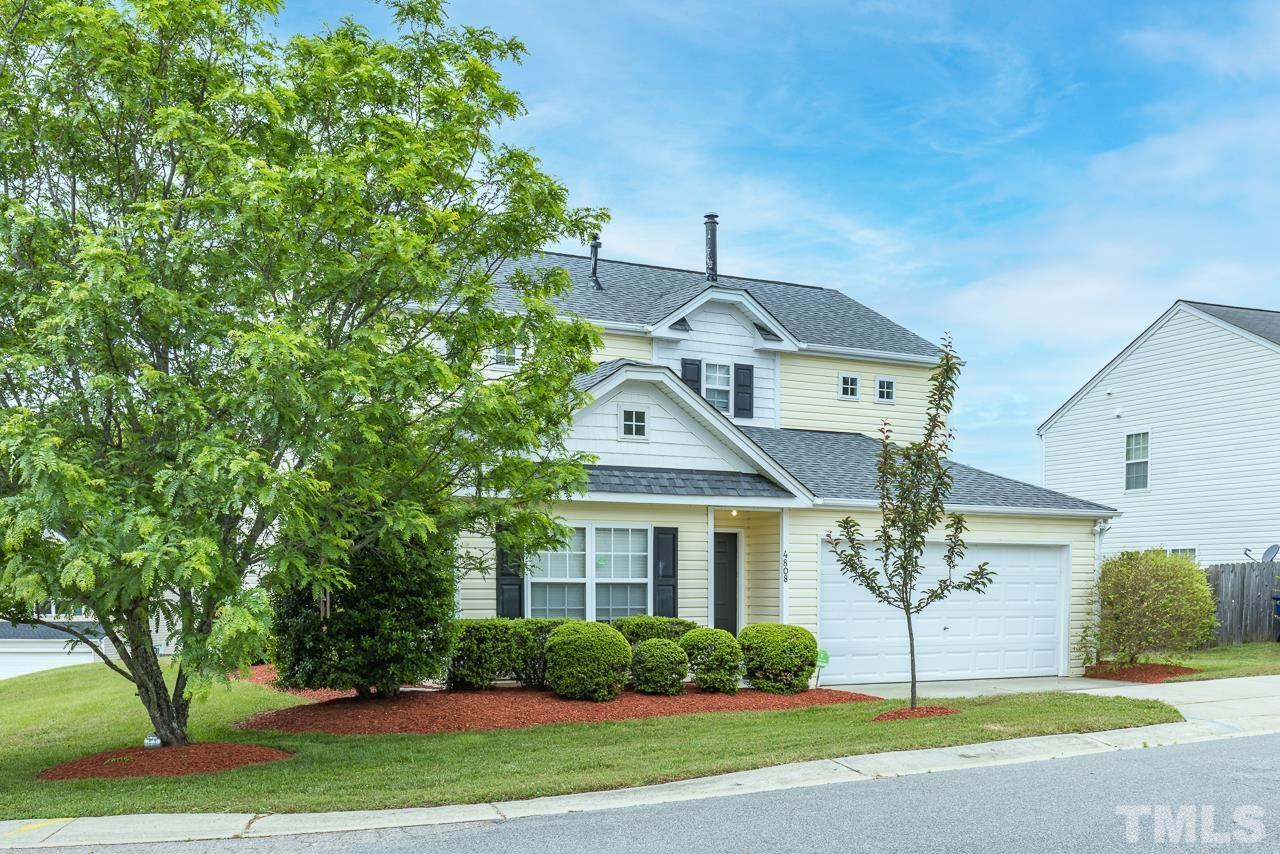 4808 Marathon Lane Raleigh, NC 27616 - Photo 2 of 31 a front view of a house with a garden