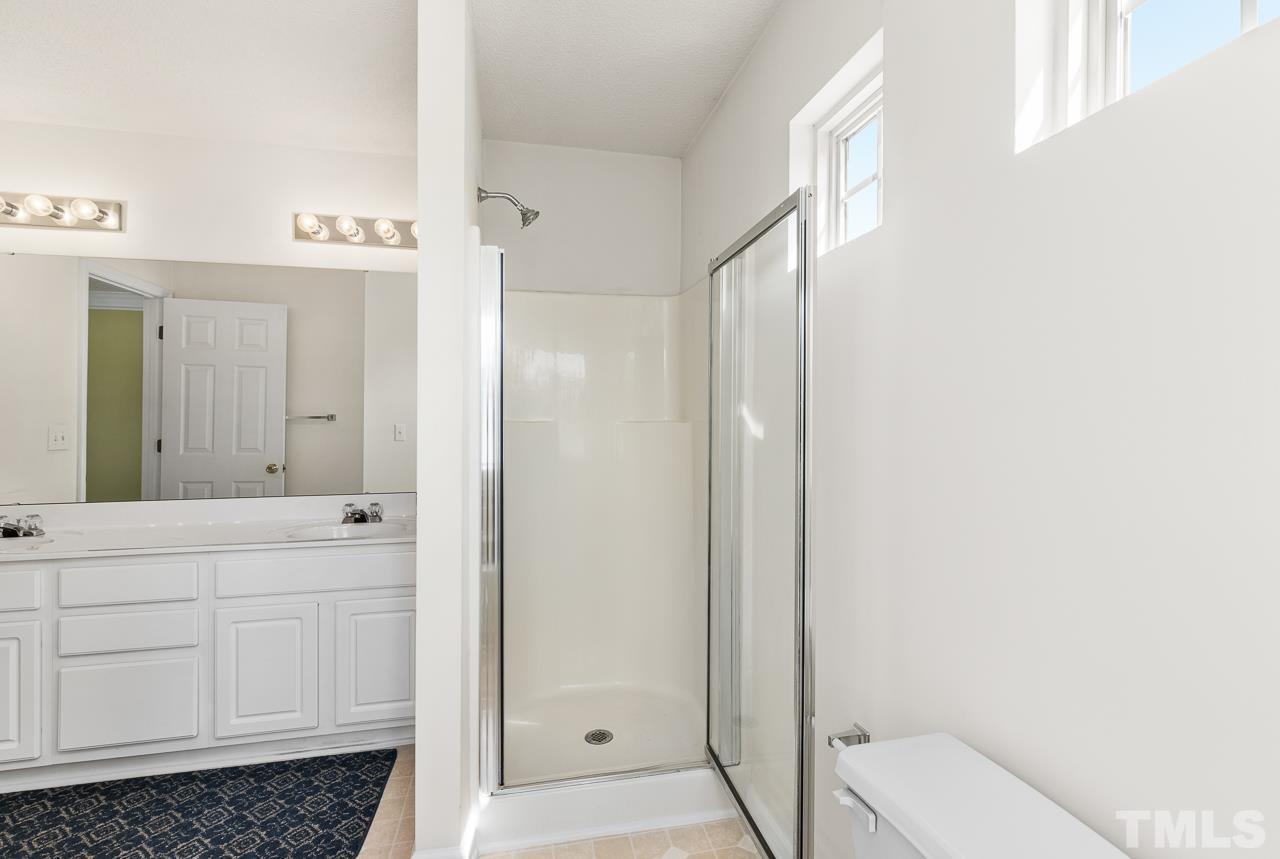 4808 Marathon Lane Raleigh, NC 27616 - Photo 21 of 31 a bathroom with a shower and a sink