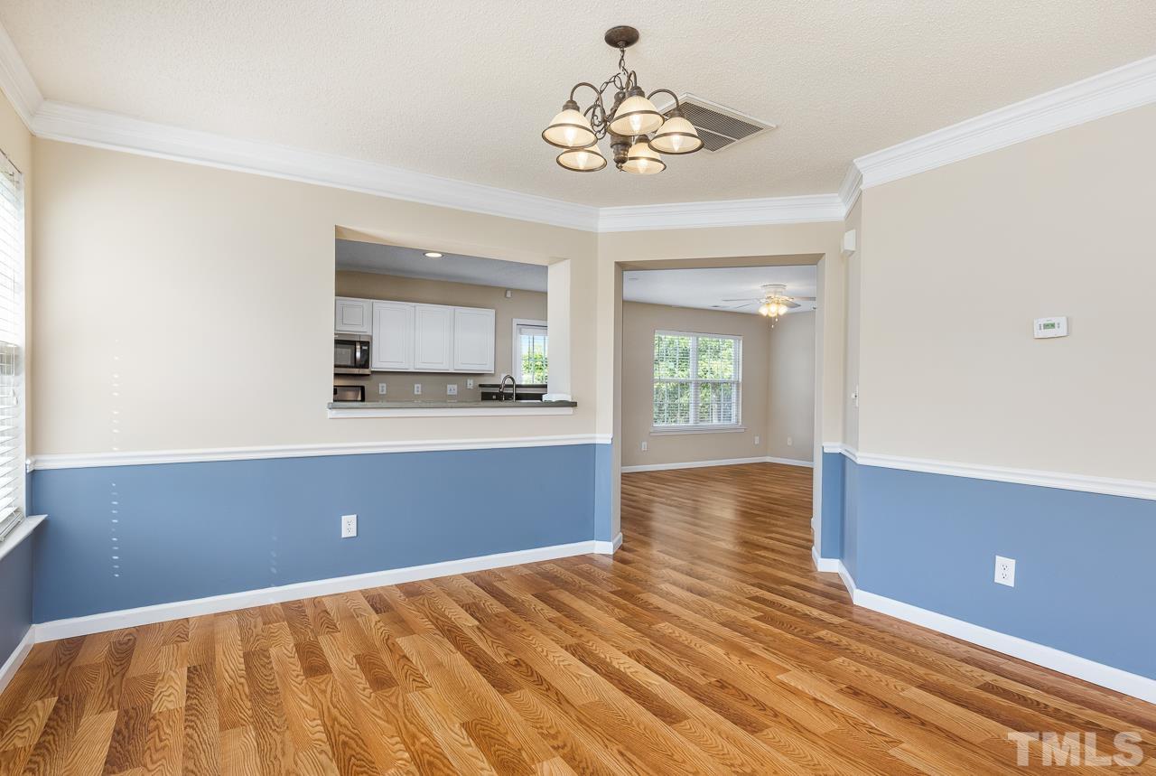 4808 Marathon Lane Raleigh, NC 27616 - Photo 7 of 31 a view of kitchen and hall with wooden floor