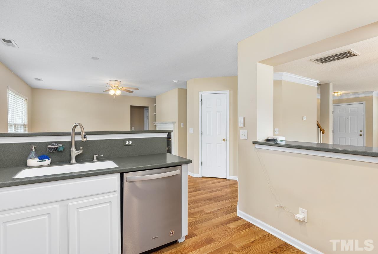 4808 Marathon Lane Raleigh, NC 27616 - Photo 10 of 31 a kitchen with a sink cabinets and wooden floor