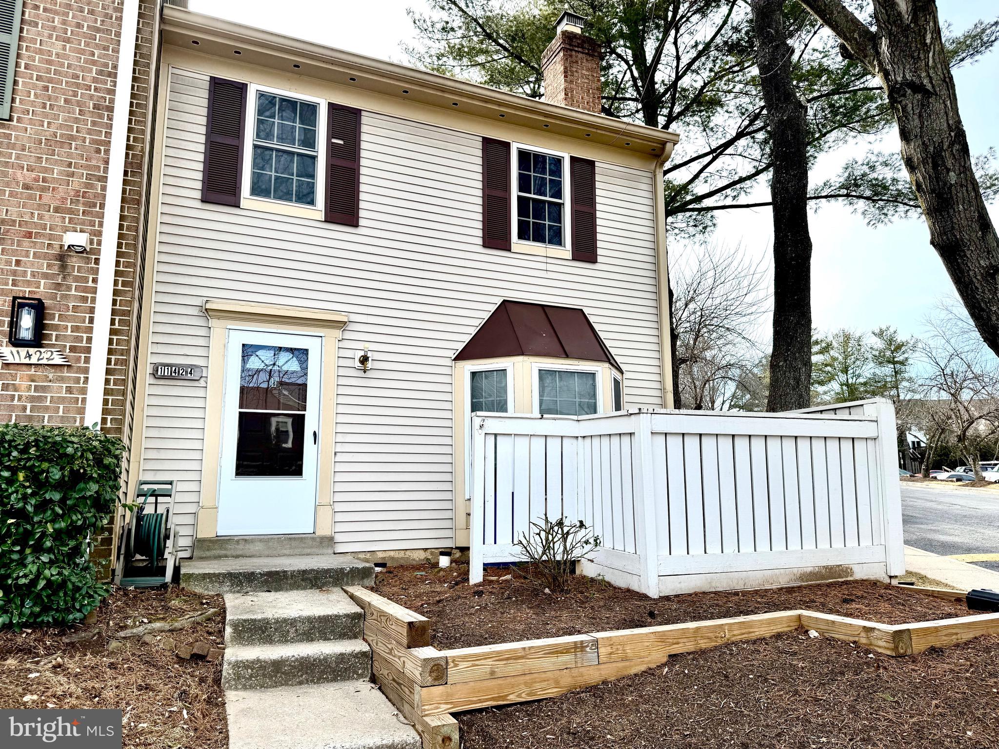 11424 Appledowre Way, Unit 30 Germantown, MD 20876 - Photo 1 of 37 a front view of a house with a yard