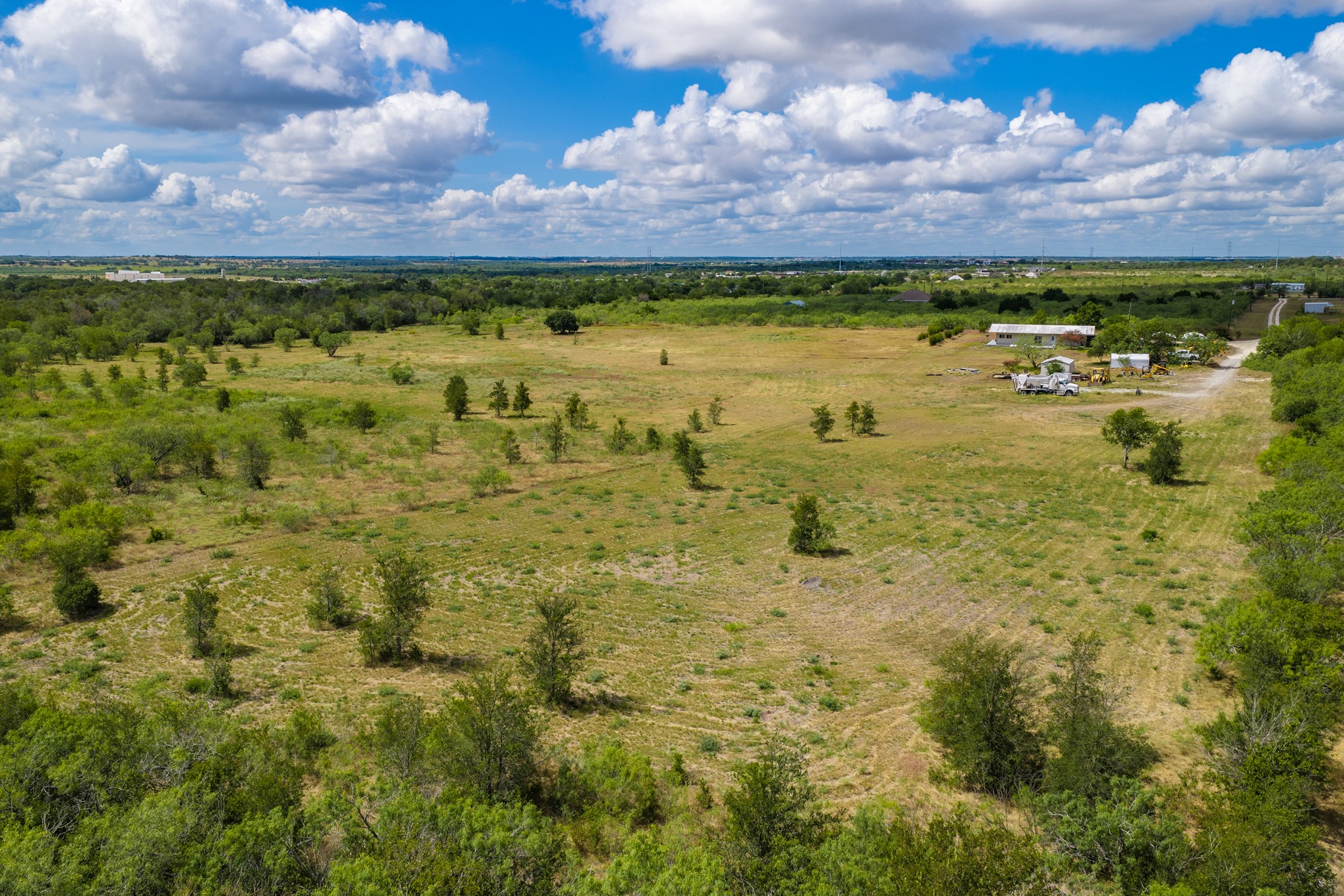 8804 Williamson Road Buda, TX 78610 - Photo 30 of 37 Rolling green acreage opens to endless blue skies and natural country views.