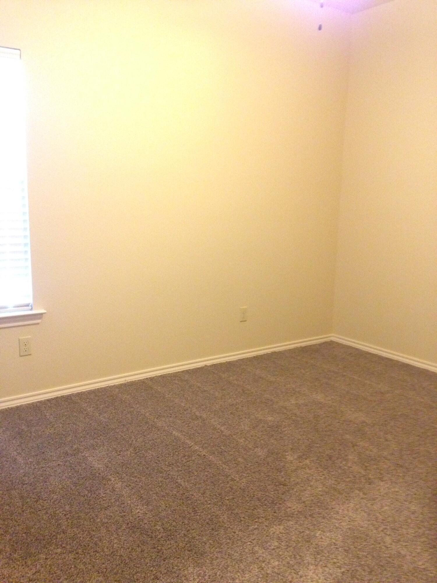 1212 Preston Trail, Unit A Wolfforth, TX 79382 - Photo 10 of 12 a view of an empty room