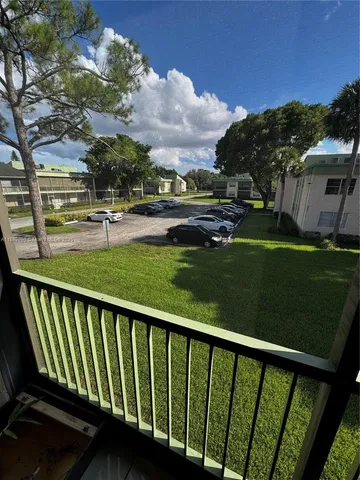 a view of a backyard with sitting area