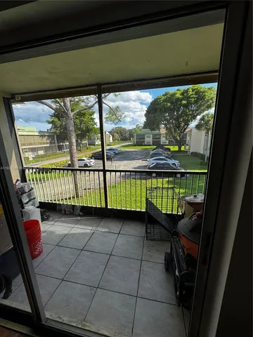 a view of a room with a large window